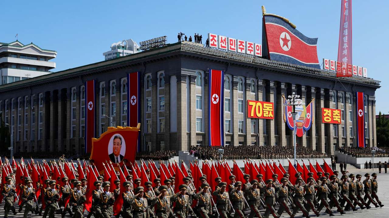 FILE PHOTO: Soldiers march with the portrait of North Korean founder Kim Il Sung during a military parade marking the 70th anniversary of country's foundation in Pyongyang
