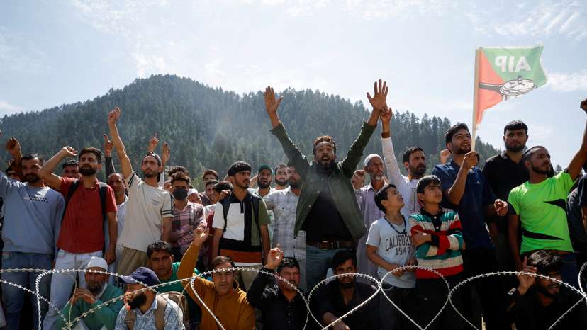 Supporters of Abdul Rashid Sheikh, leader of Awami Ittehad Party, attend an election campaign rally in North Kashmir's Kupwara district