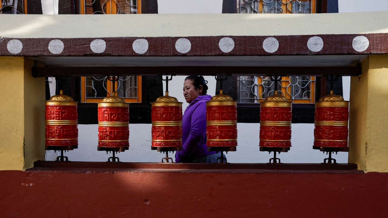 Tibetans in Nepal offer prayers at a monastery in memory of those killed in the recent earthquake, at the Tibetan Refugee Camp in Lalitpur