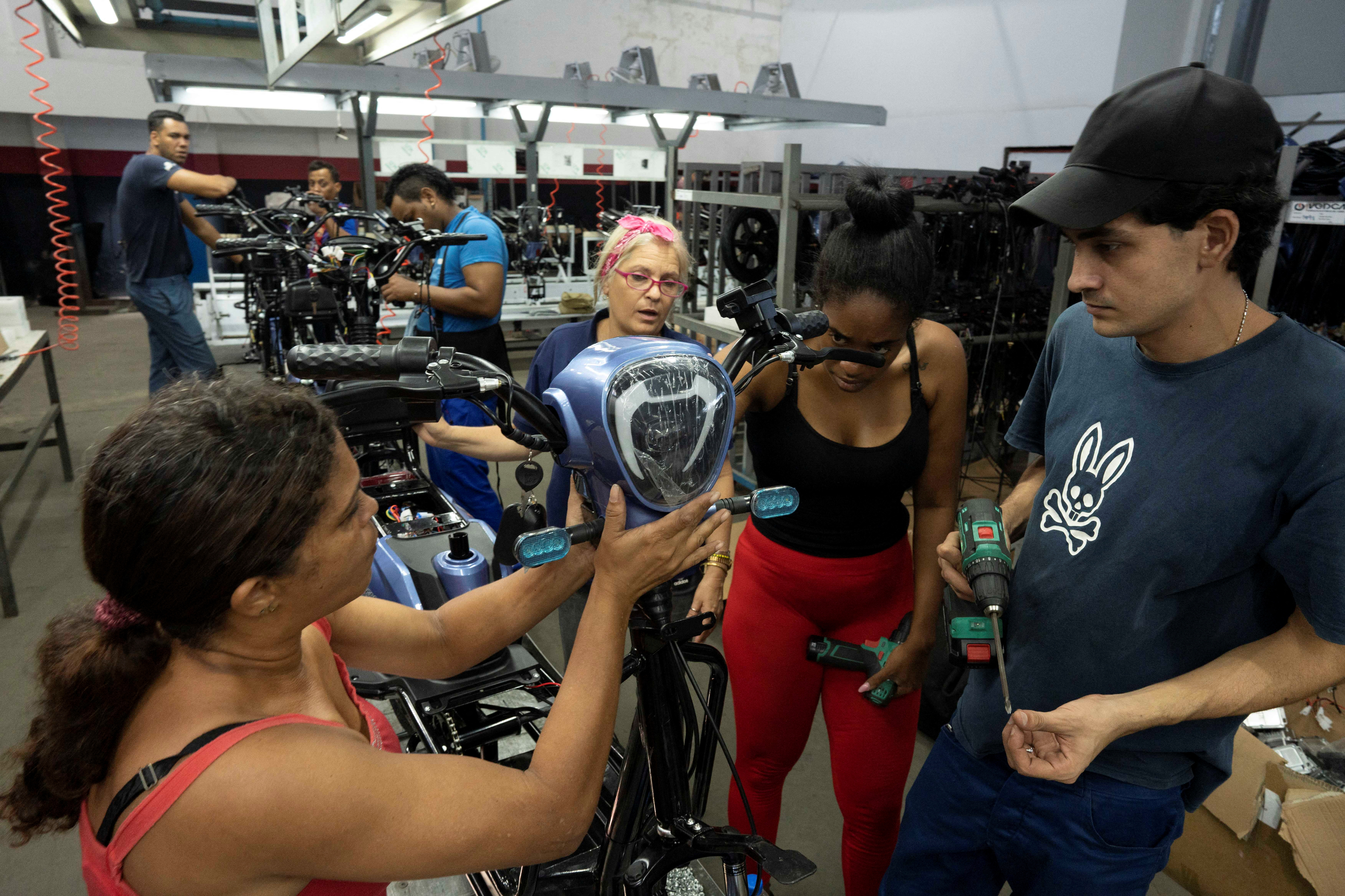 Cubans assemble Chinese electric cars and scooters in Havana amid fuel shortages