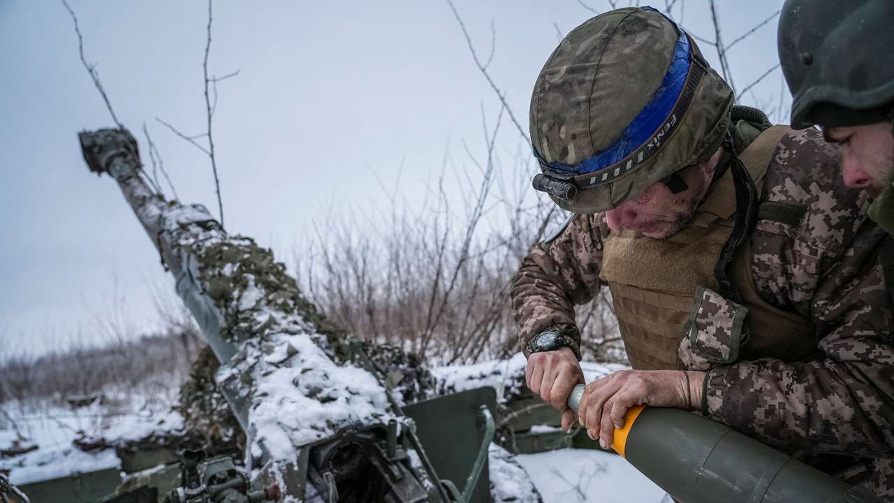 FILE PHOTO: Ukrainian servicemen prepare fire a 120-mm towed artillery pieces-mortar towards Russian troops at a position near Bakhmut
