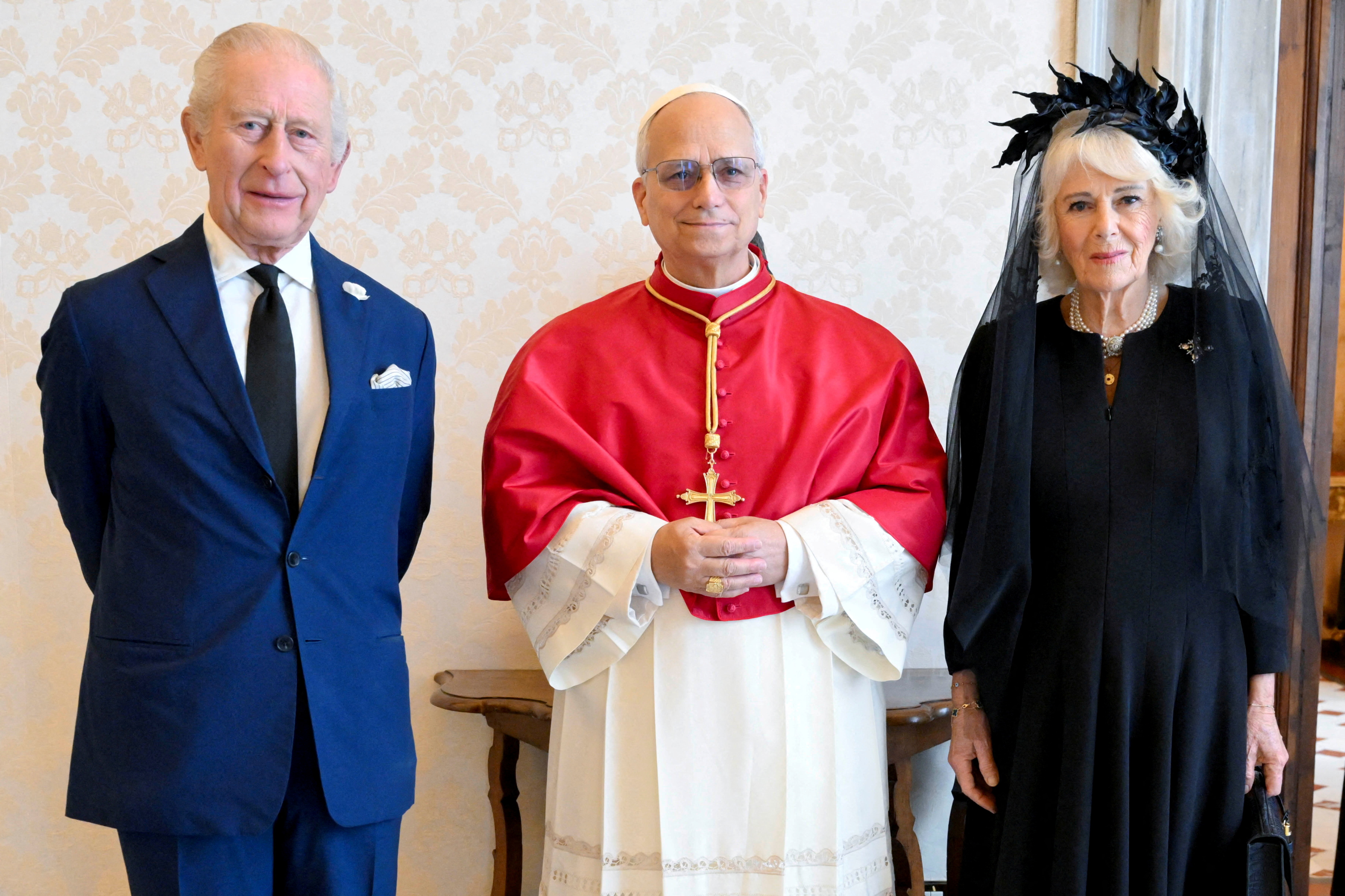 Pope Leo XIV meets with Britain's King Charles and Queen Camilla during a private audience at the Vatican