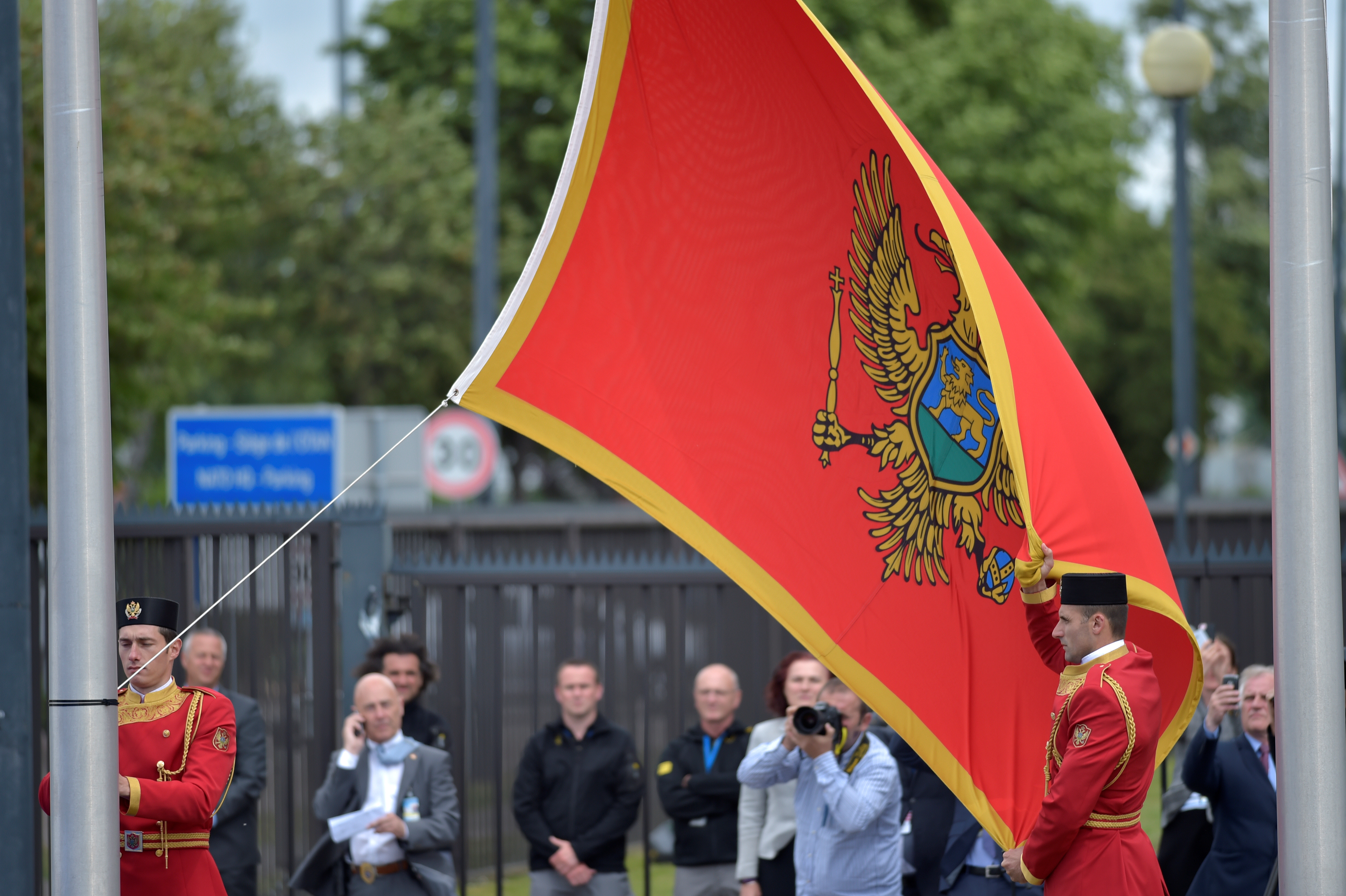 Flag of Montenegro is raised during a ceremony to mark the accession to NATO of Montenegro at NATO headquarters in Brussels