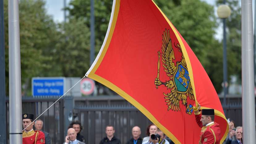 Flag of Montenegro is raised during a ceremony to mark the accession to NATO of Montenegro at NATO headquarters in Brussels