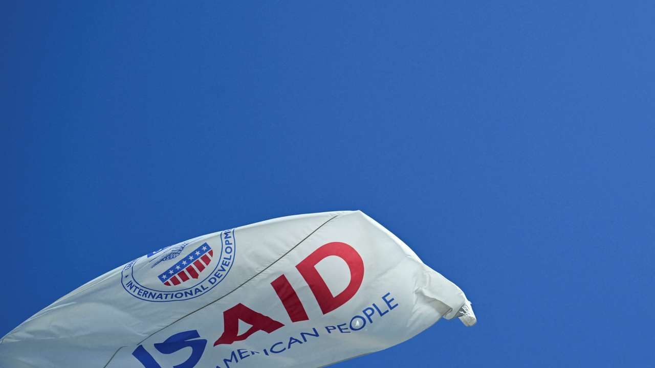 The USAID flag flies outside the USAID building in Washington
