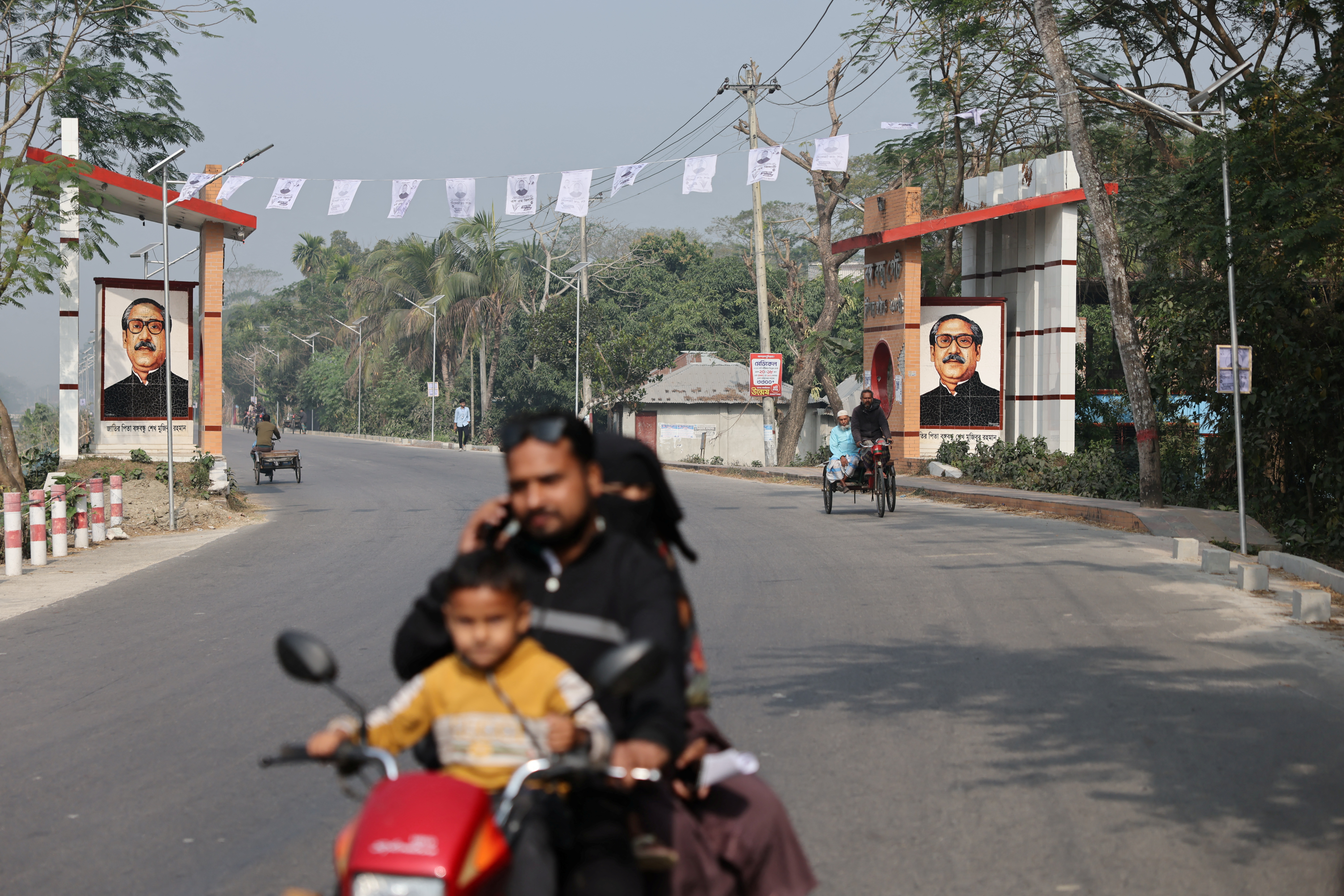 Images of Sheikh Mujibur Rahman, the father of former Prime Minister Sheikh Hasina, are displayed at Bangabandhu Gate in Gopalganj
