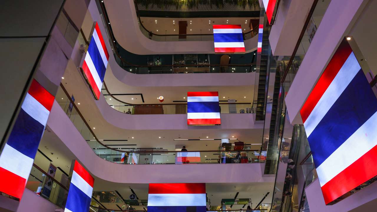 Digital screens with Thai national flags in support of the country in Bangkok