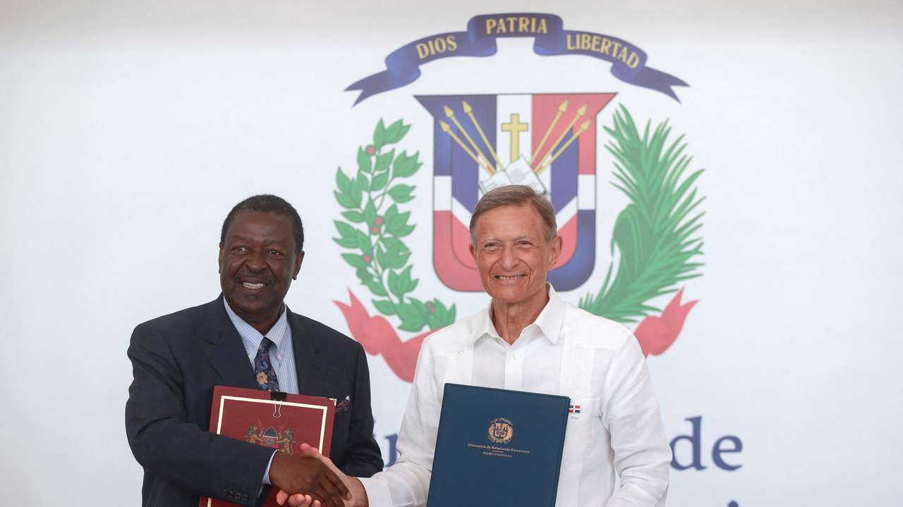 Kenya's Prime Cabinet Secretary Musalia Mudavadi and Dominican Foreign Minister Roberto Alvarez sign a bilateral agreement in Santo Domingo