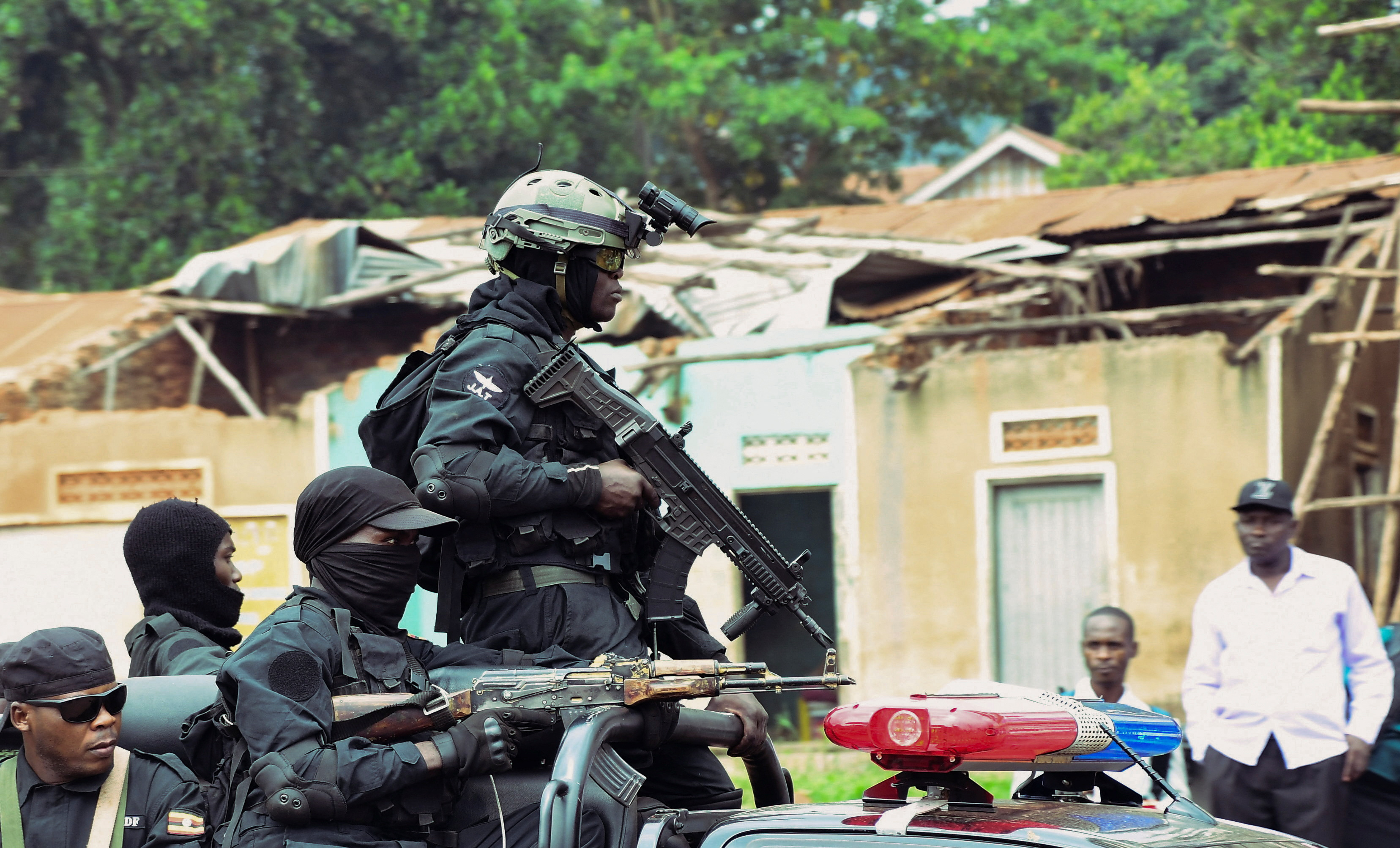 Police and troops block Ugandan opposition NUP's headquarters ahead of protest, in Kampala