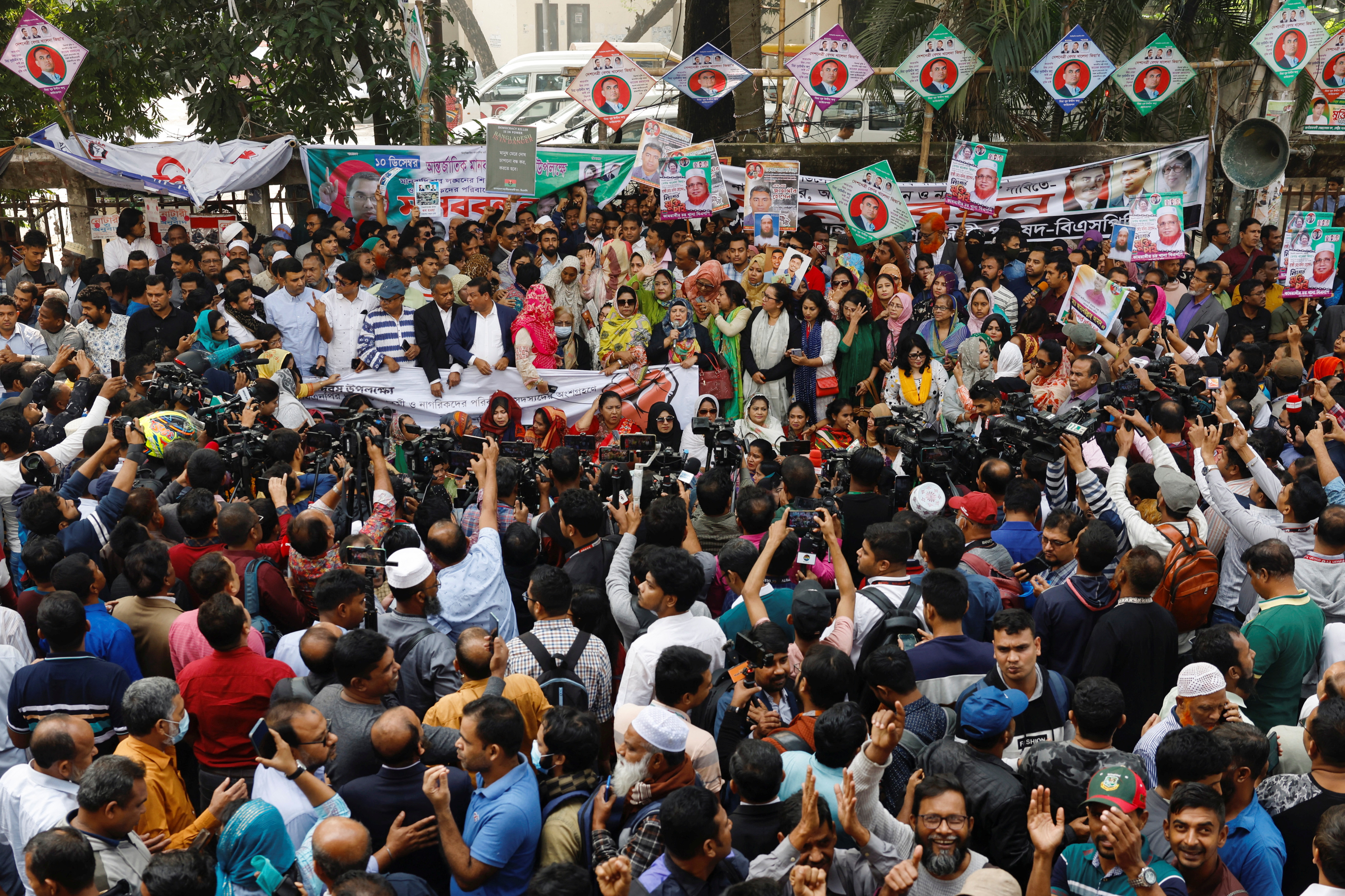 Members of the Bangladesh Nationalist Party (BNP) join in a human-chain protest to mark the International Human Rights Day, demanding the release of BNP activists who were arrested, in Dhaka