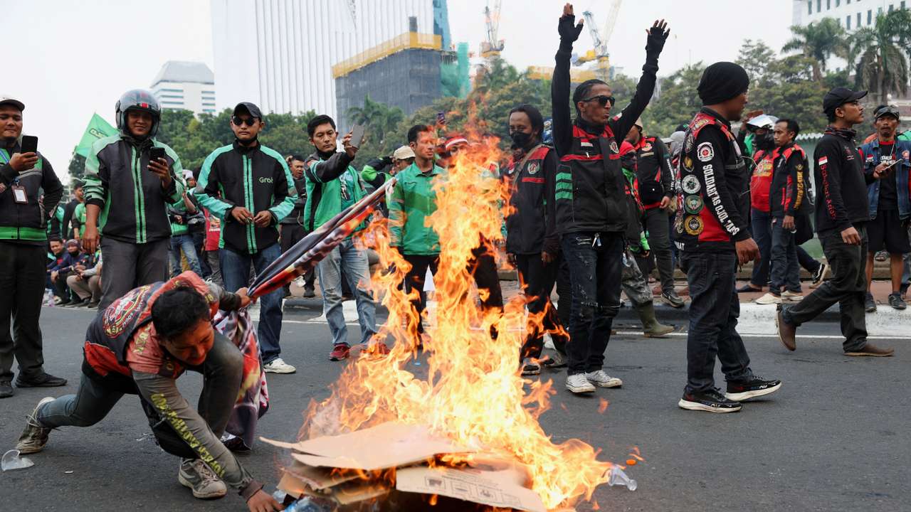 Motorcycle taxi drivers working for online ride-hailing start-ups protest against low tariffs in Jakarta