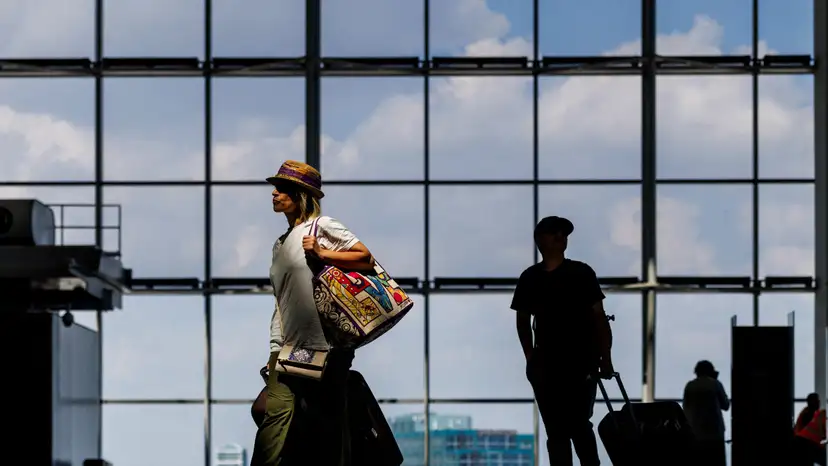 Travellers at Pearson International Airport in Mississauga, Ontario