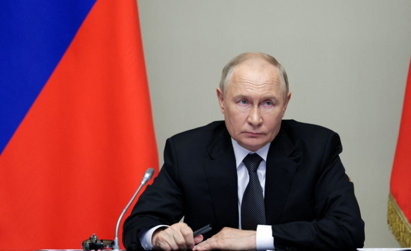 Russia's President Putin chairs a meeting with security officials and regional governors outside Moscow
