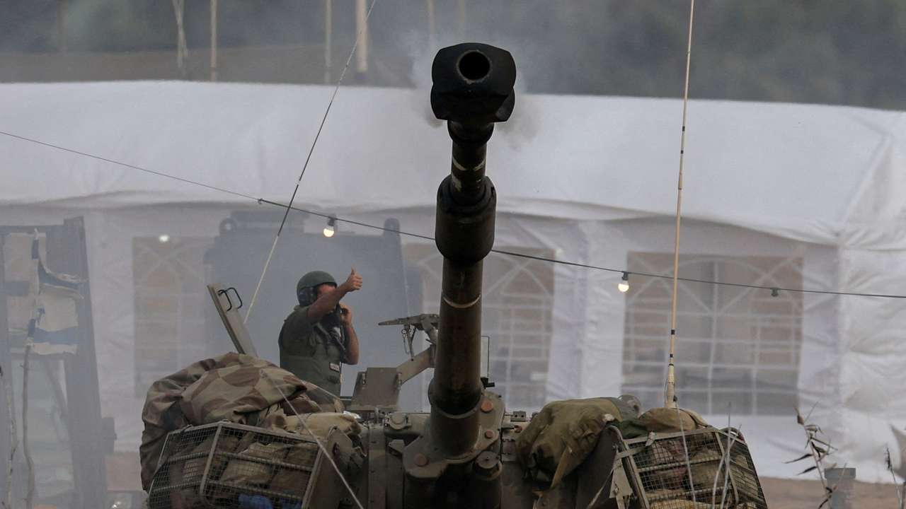 An Israeli artillery unit fires near the Israel-Gaza border