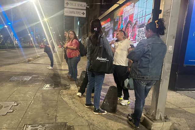 People wait outside their homes and buildings in Mexico City