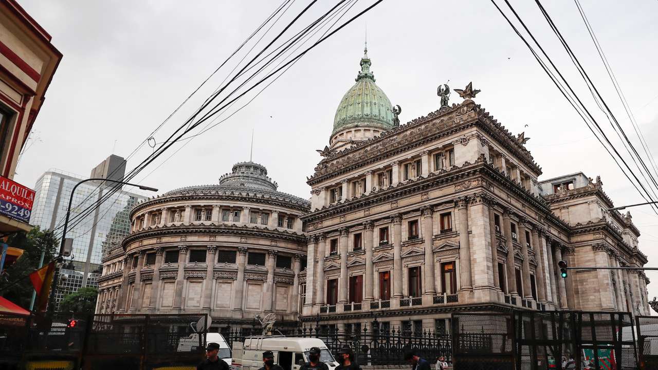 Police officers stand in front of the National Congress in Buenos Aires, Argentina