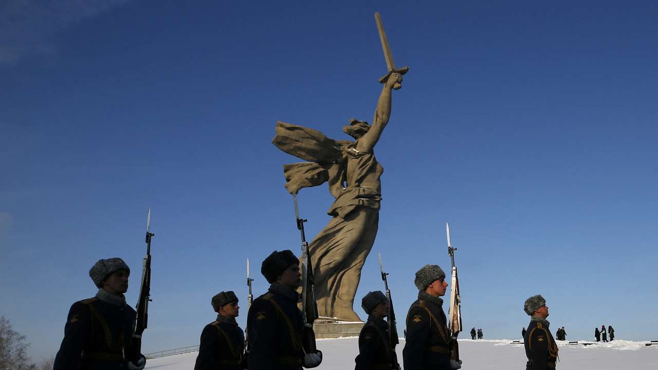 FILE PHOTO: Honour guards march past “The Motherland Calls” monument during an event to commemorate the 75th anniversary of the battle of Stalingrad in World War Two, at the Mamayev Kurgan memorial complex in Volgograd