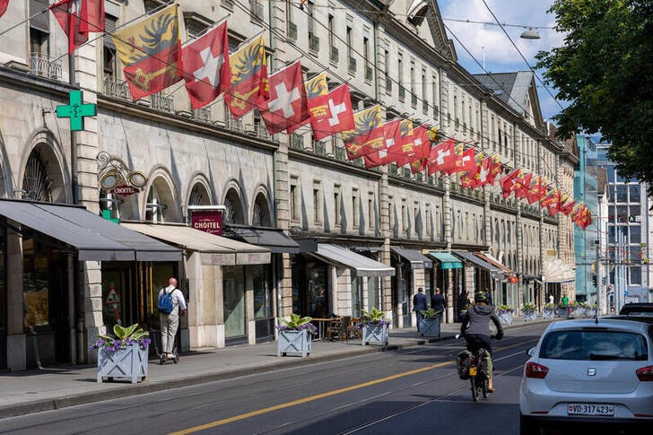 FILE PHOTO: Swiss and Canton de Geneve flags are seen in the Corraterie Street in Geneva