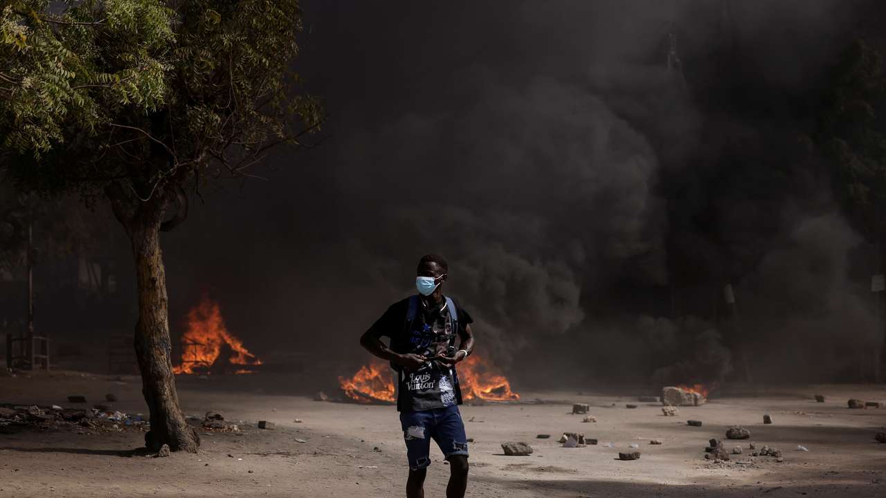 Senegalese demonstrators protest against the postponement of the Feb. 25 presidential election, in Dakar