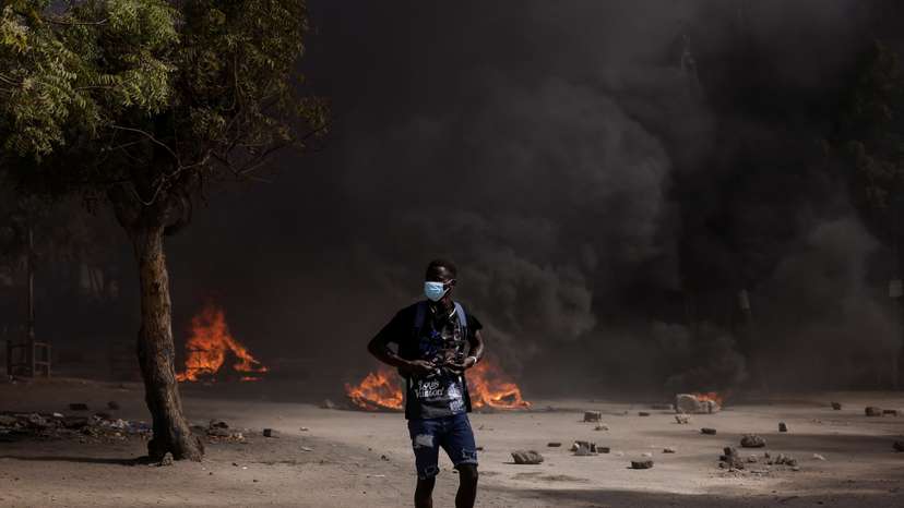 Senegalese demonstrators protest against the postponement of the Feb. 25 presidential election, in Dakar