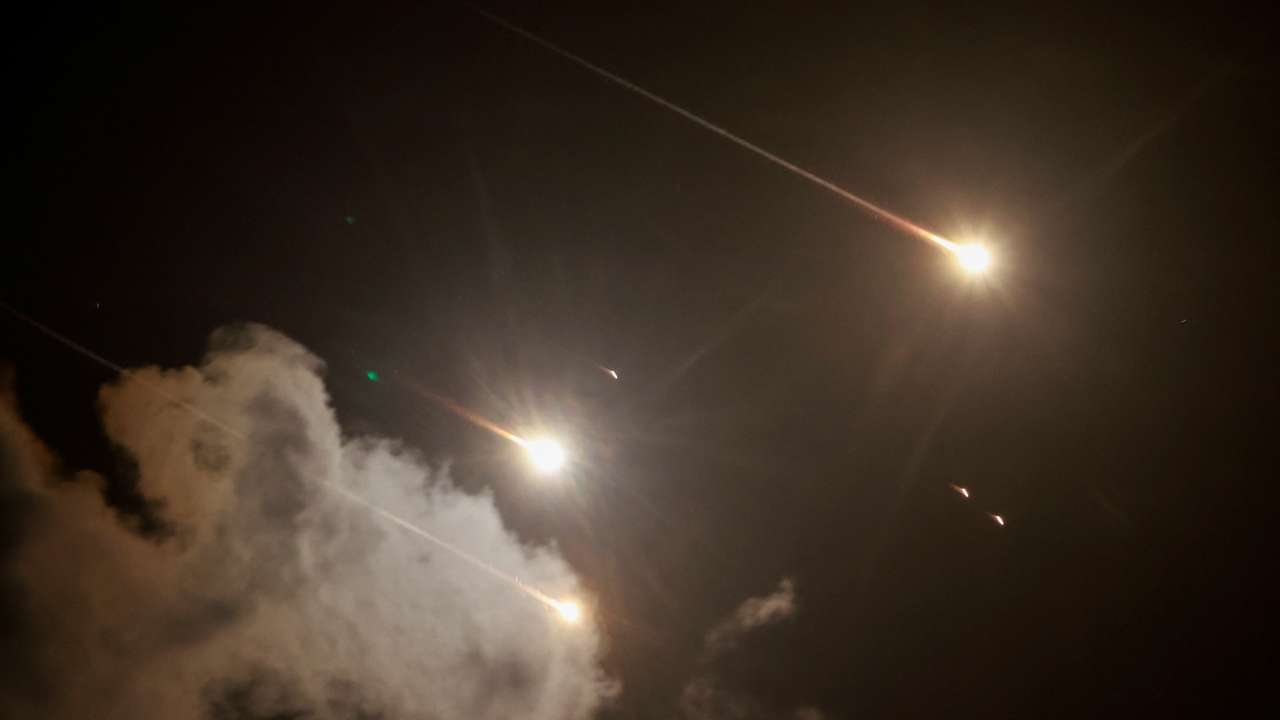 Projectiles are seen in the sky after Iran fired a salvo of ballistic missiles, amid cross-border hostilities between Hezbollah and Israel, as seen from Tel Aviv