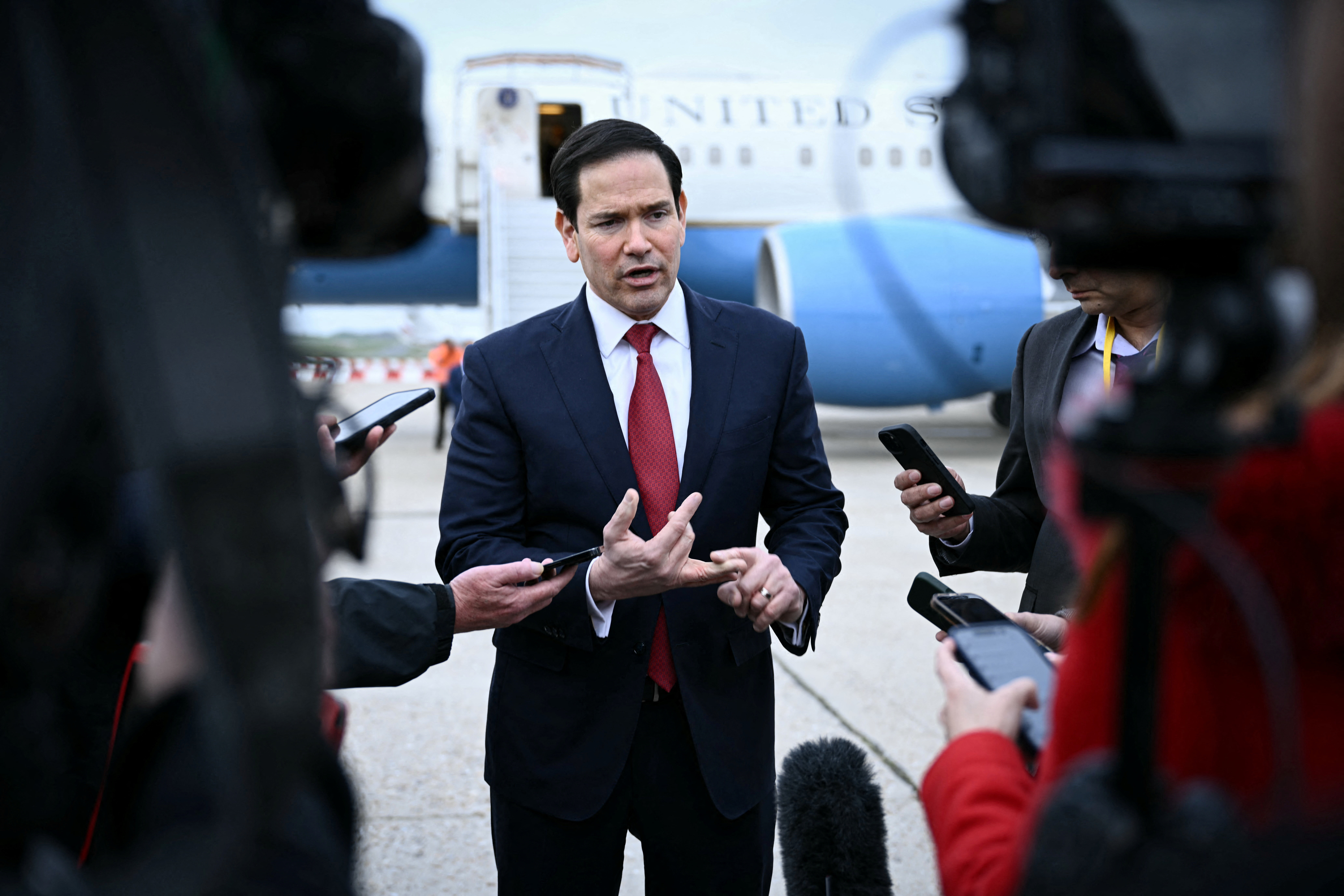 US Secretary of State Marco Rubio speaks to the press following a G7 Foreign Ministers' meeting with Partner Countries before his departure at the Bourget airport