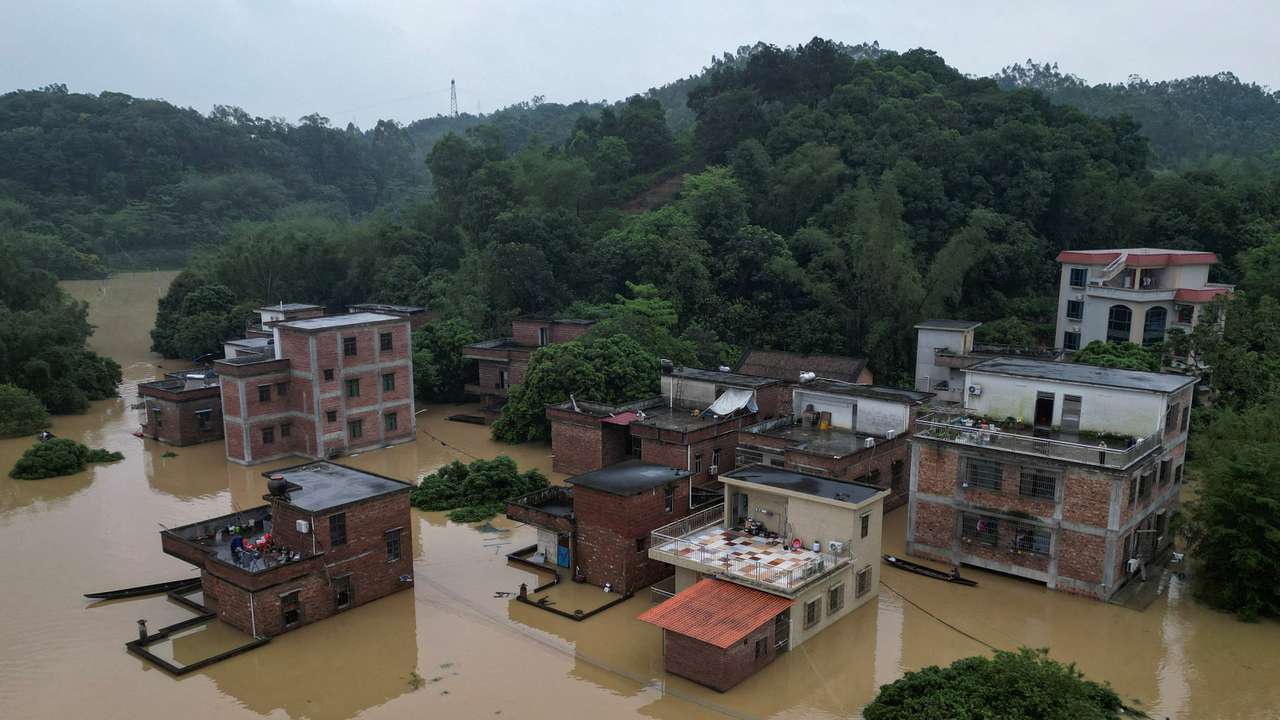 FILE PHOTO: Drone view shows houses submerged in floodwaters following heavy rainfall, at a village in Qingyuan