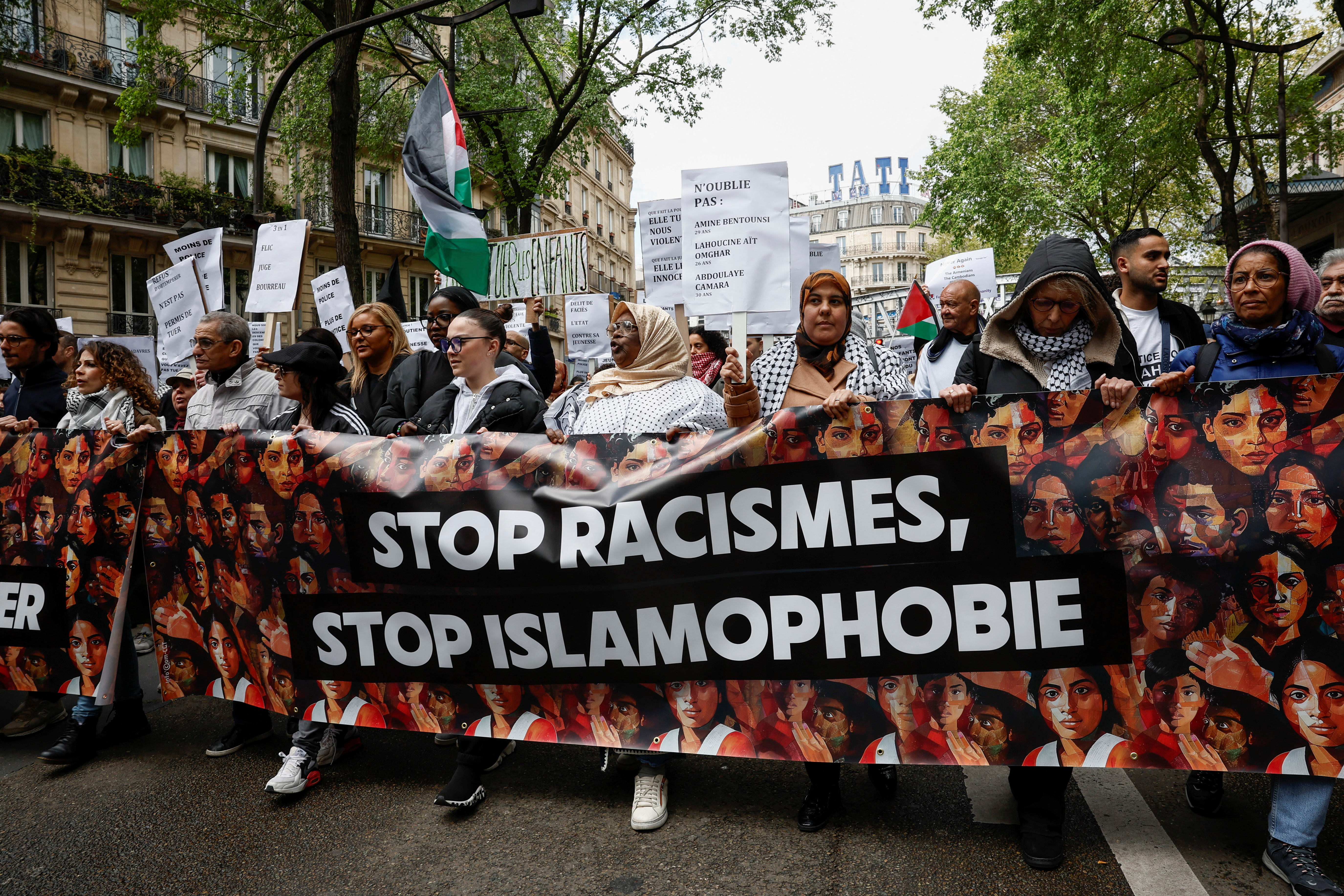 People march in a protest against racism, Islamophobia and the protection of children, in Paris