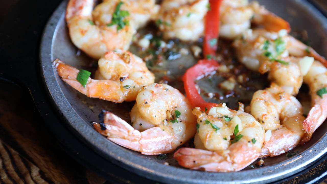 Gambas a la Plancha, Spanish marinated sizzling grilled shrimp at Basque Tapas Bar Restaurant in Piermont Oct. 23, 2018.