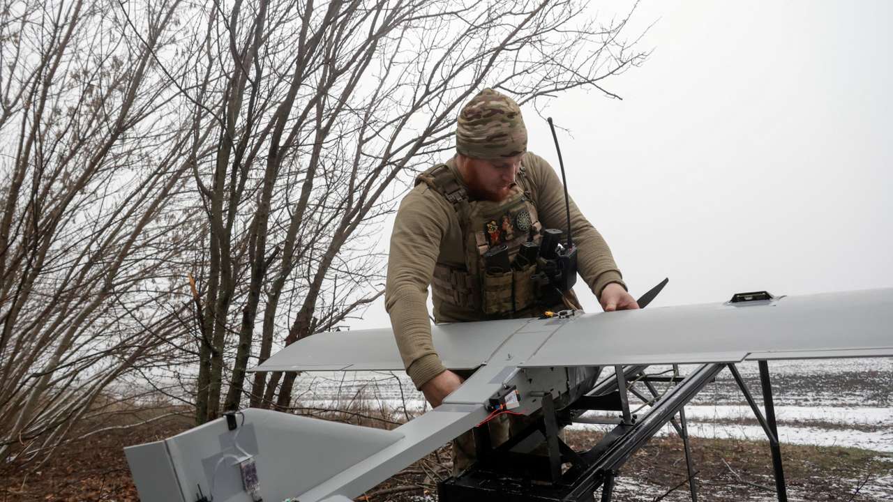 FILE PHOTO: Ukrainian servicemen operate a Darts strike drone at their position near a front line in Donetsk region