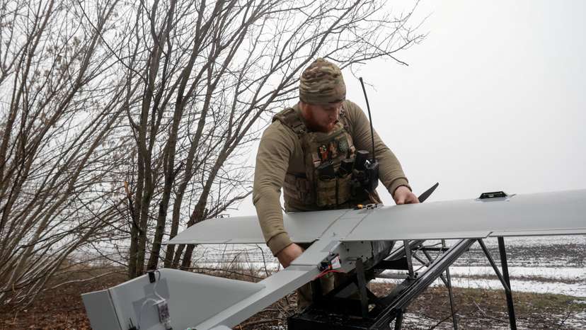 FILE PHOTO: Ukrainian servicemen operate a Darts strike drone at their position near a front line in Donetsk region