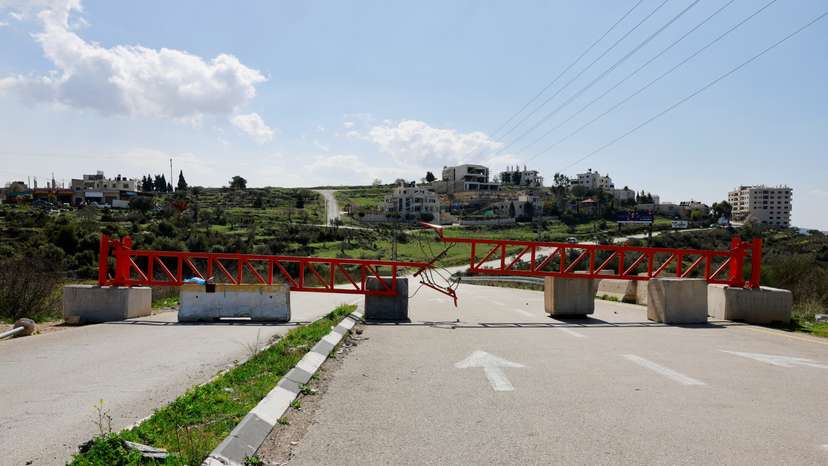 A closed Israeli military gate stands near Ramallah