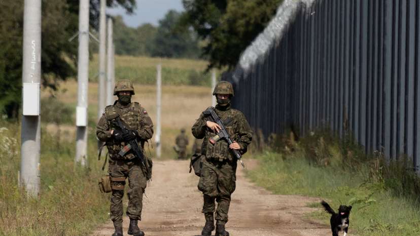 FILE PHOTO: Polish soldiers patrol the Polish-Belarusian border