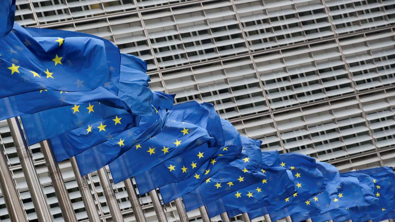 FILE PHOTO: Flags flutter outside EU Commission in Brussels