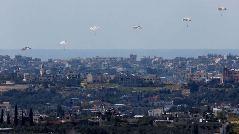 Packages fall towards northern Gaza, as seen from Israel