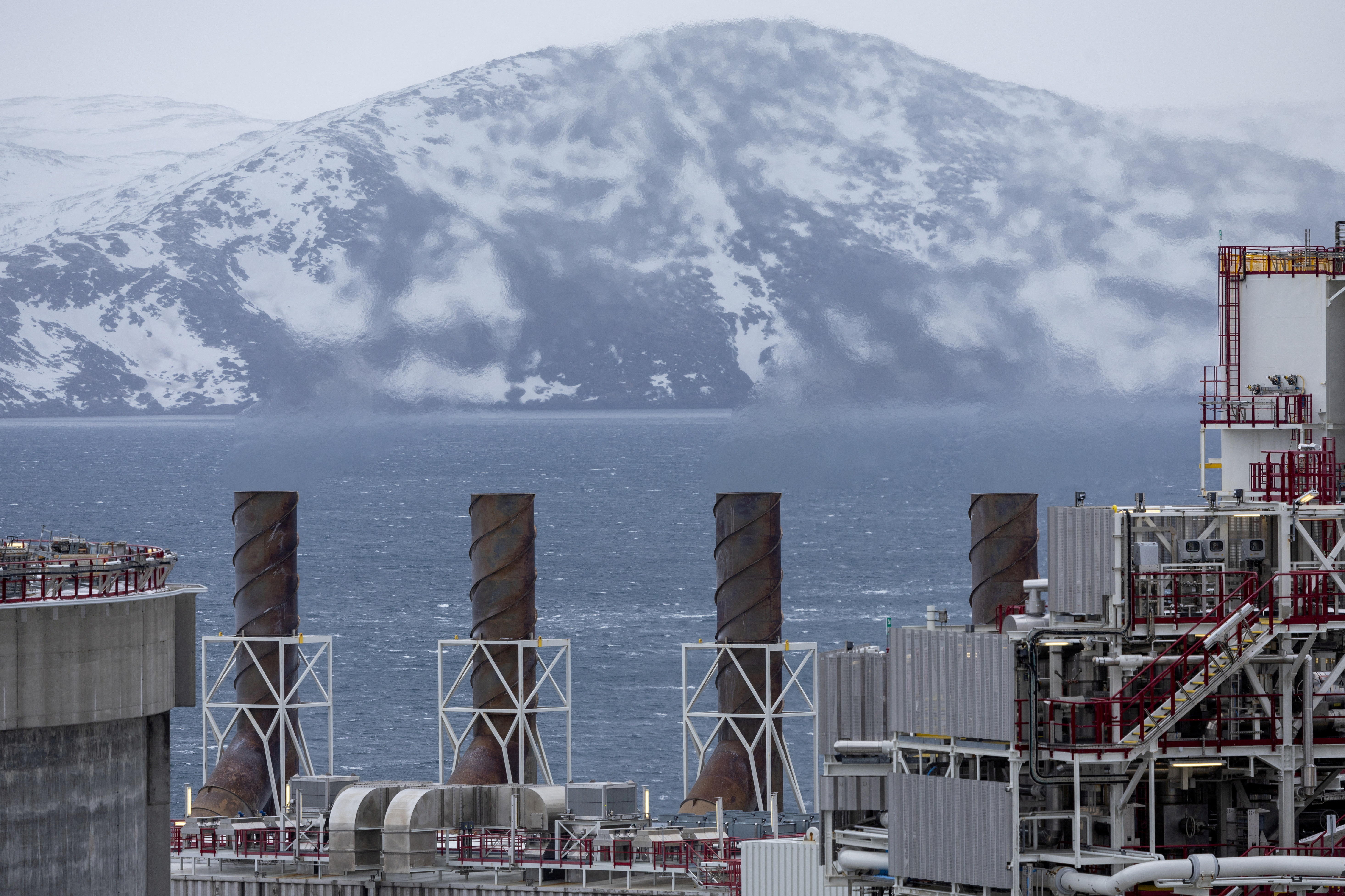 FILE PHOTO: Emissions are seen from chimneys, in Hammerfest