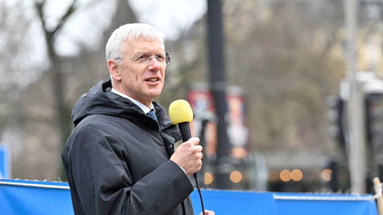 Latvian Foreign Minister Krisjanis Karins speaks at a rally in support of Ukraine at Norrmalmstorg in Stockholm