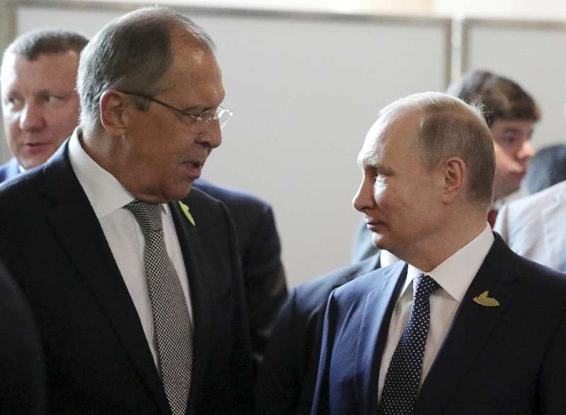 Russia's President Putin and Foreign Minister Lavrov speak during the G20 summit in Hamburg