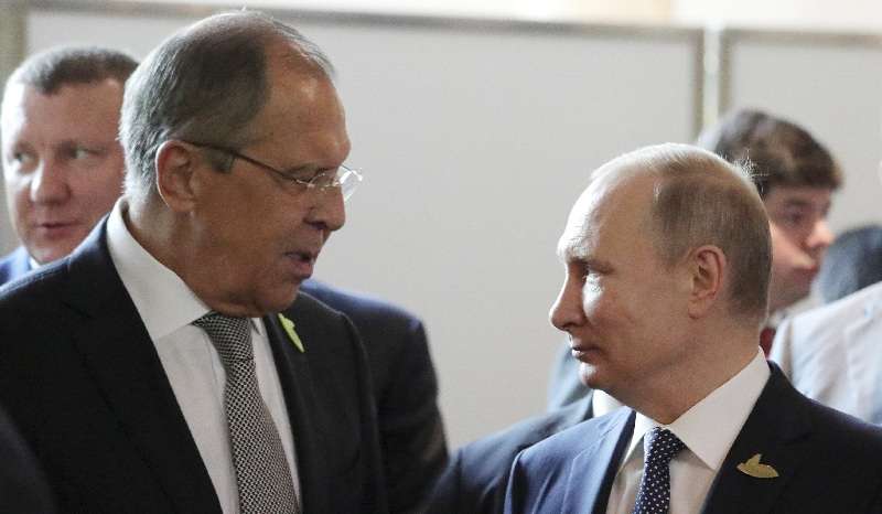 Russia's President Putin and Foreign Minister Lavrov speak during the G20 summit in Hamburg