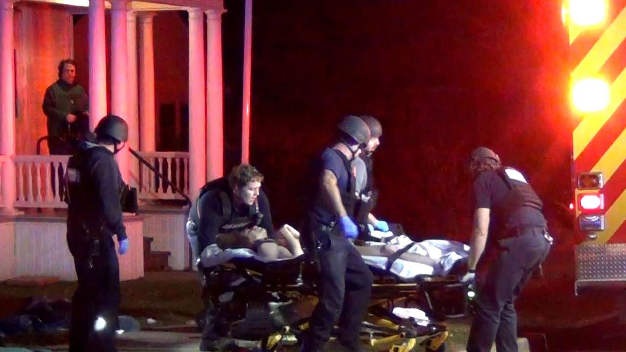 First responders treat a victim after a gunman shot and wounded three college students of Palestinian descent in Burlington