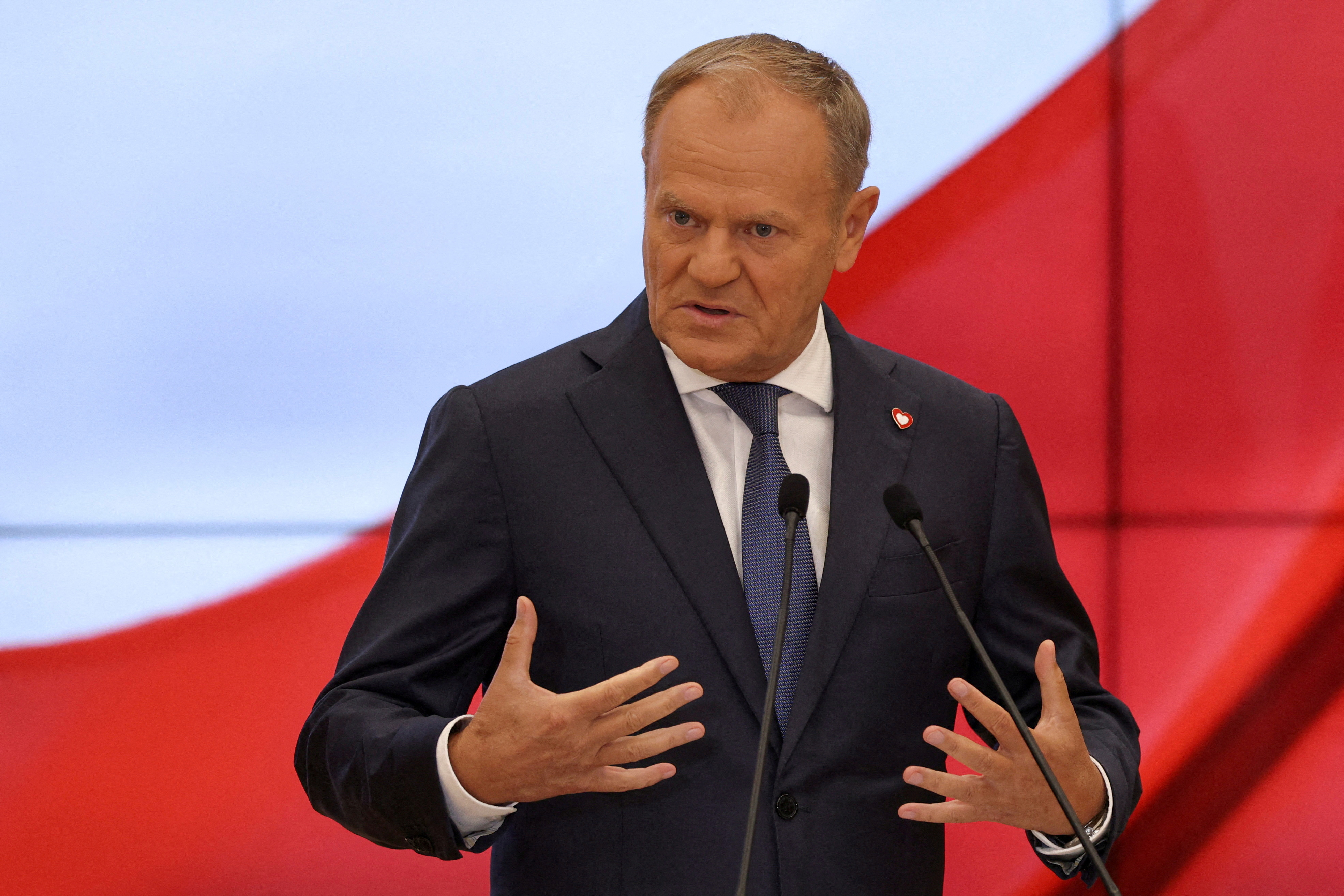 FILE PHOTO: Polish Prime Minister Donald Tusk speaks during a press conference