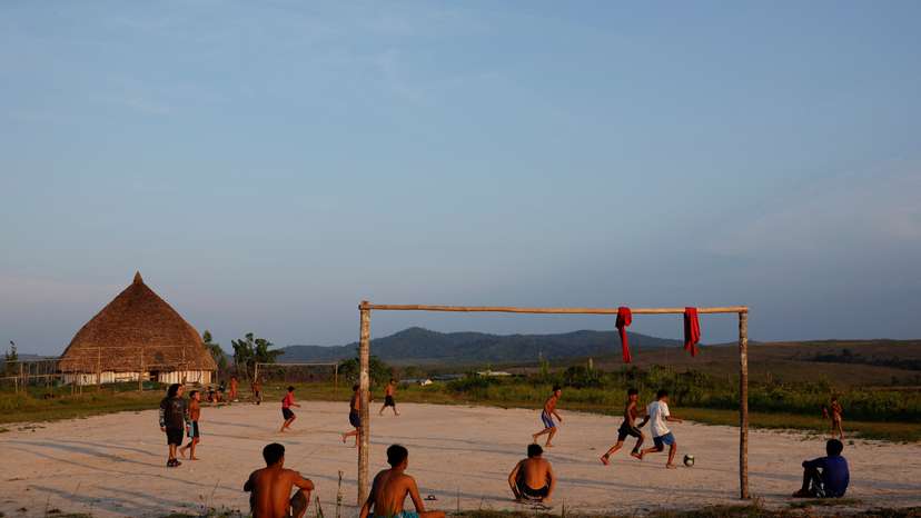 Yanomami indigenous people play football at Surucucu village, in Yanomami indigenous land