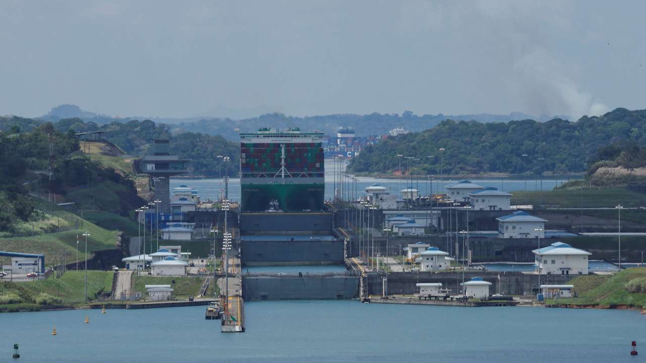Cargo vessels transit through the Panama Canal, in Colon
