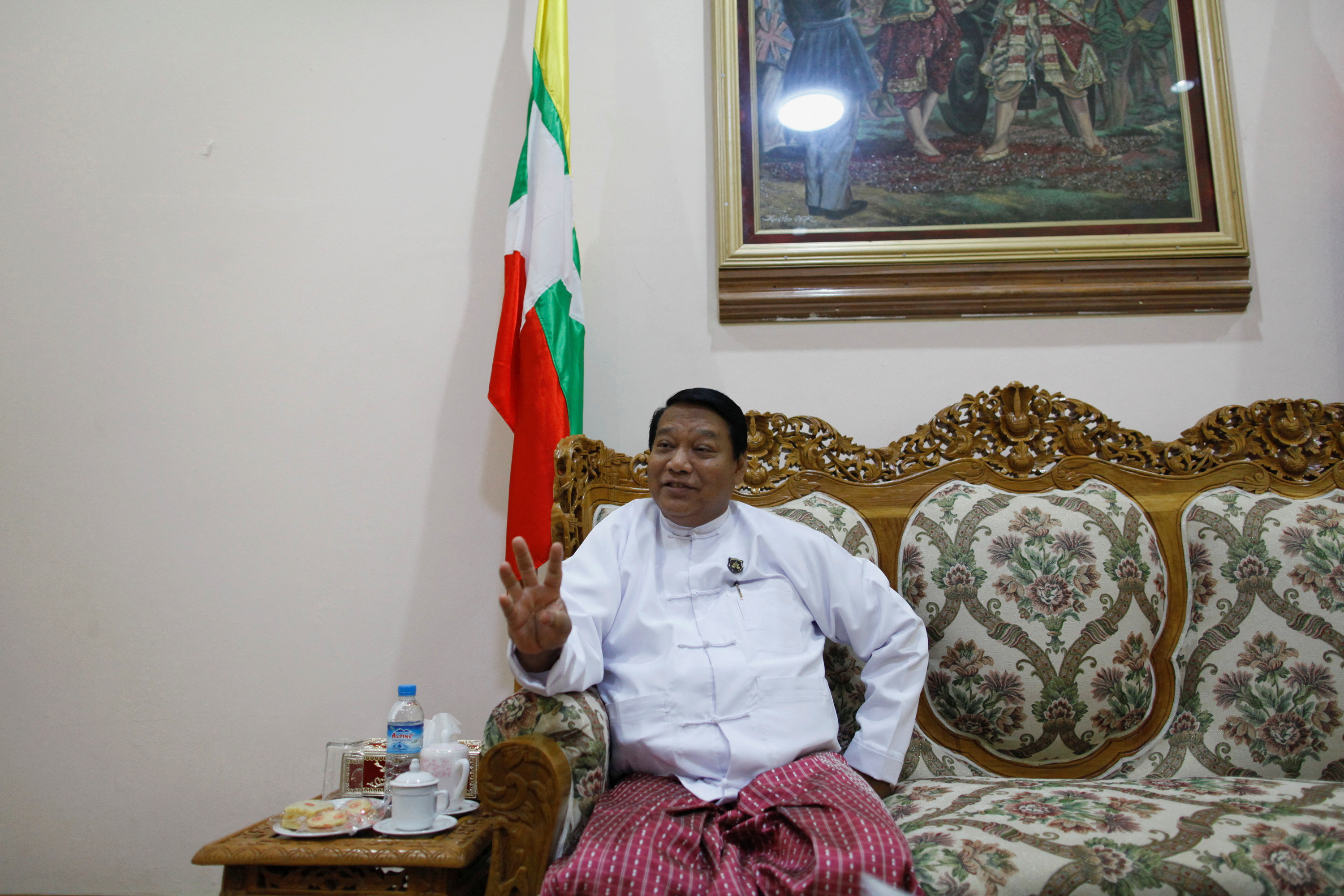 FILE PHOTO: Myanmar's Minister of Immigration and Population Khin Yi talks during an Reuters interview at his office in Naypyitaw