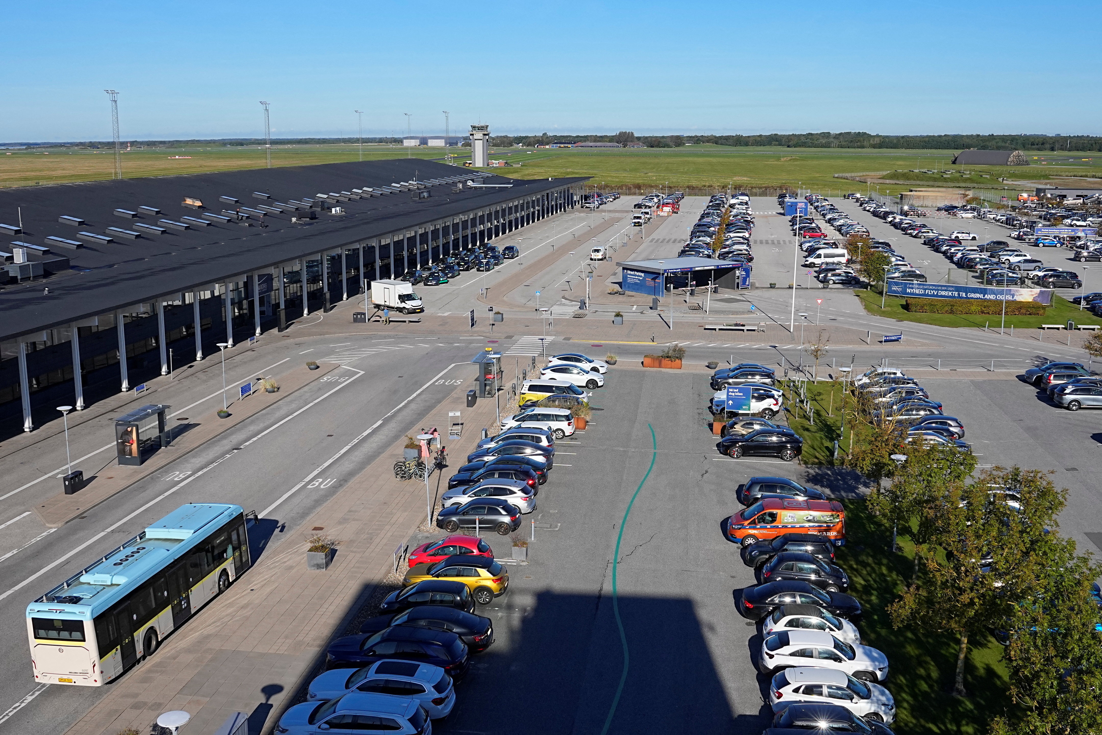 Vehicles are parked at Aalborg Airport