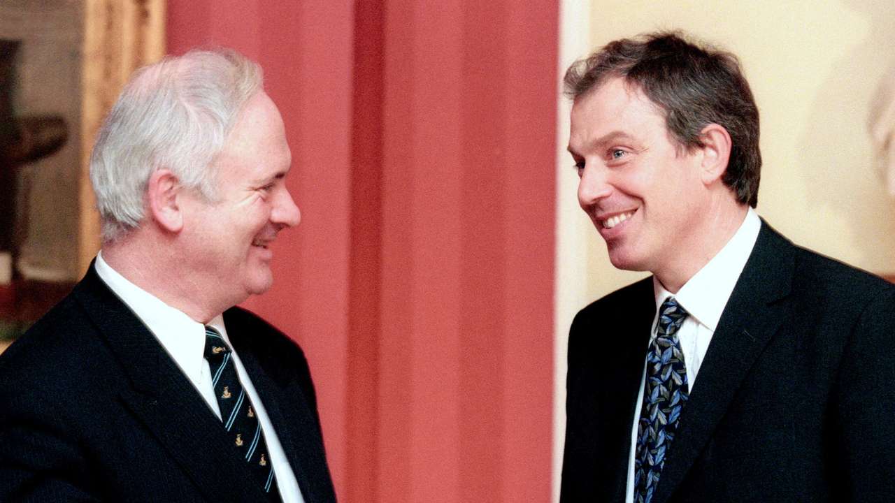 FILE PHOTO: Former Irish Prime Minister Bruton chats with Britain's Prime Minister Blair inside 10 Downing Street in London