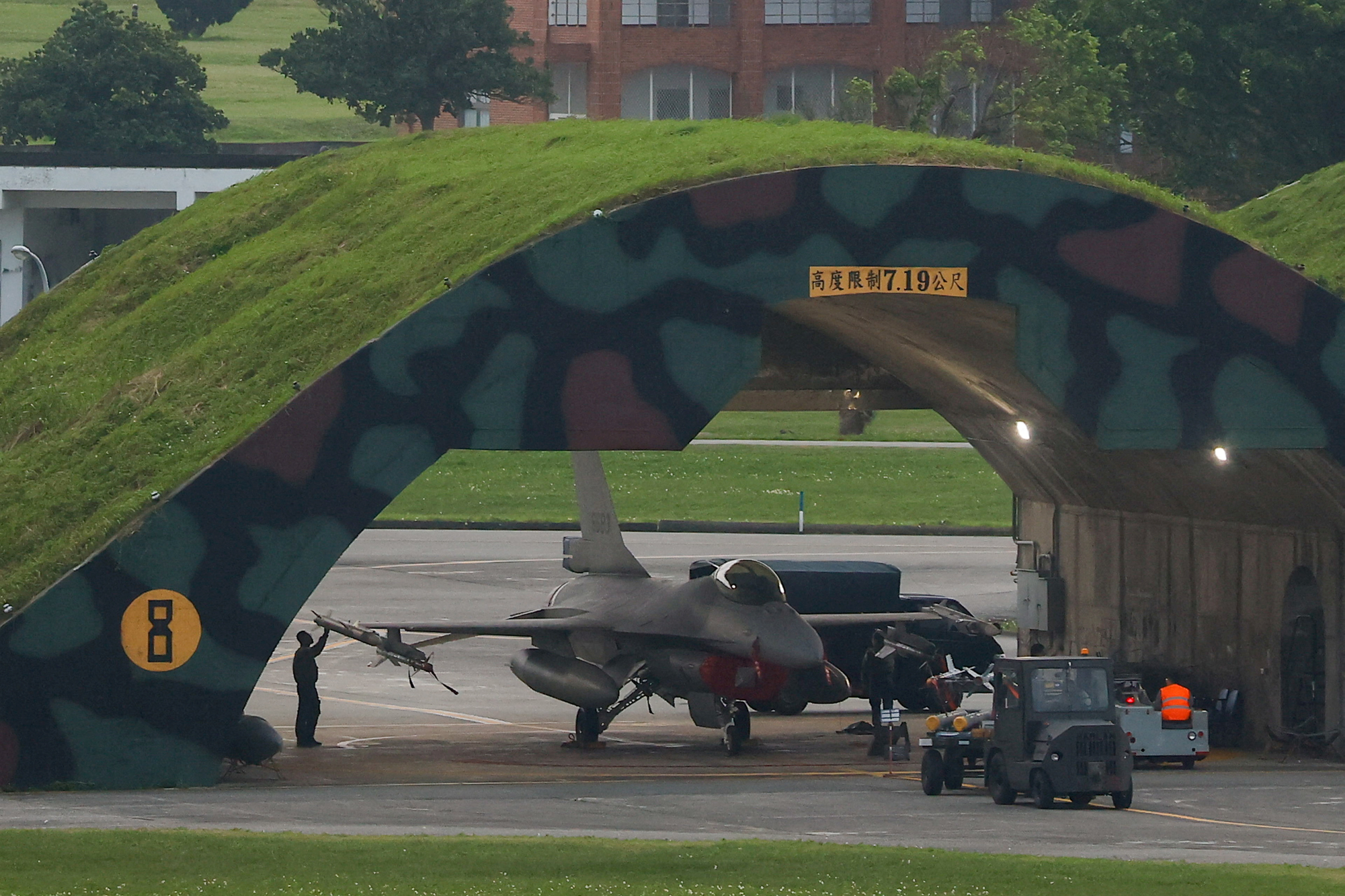 FILE PHOTO: A technician works on an F-16 at an air force base in Hualien