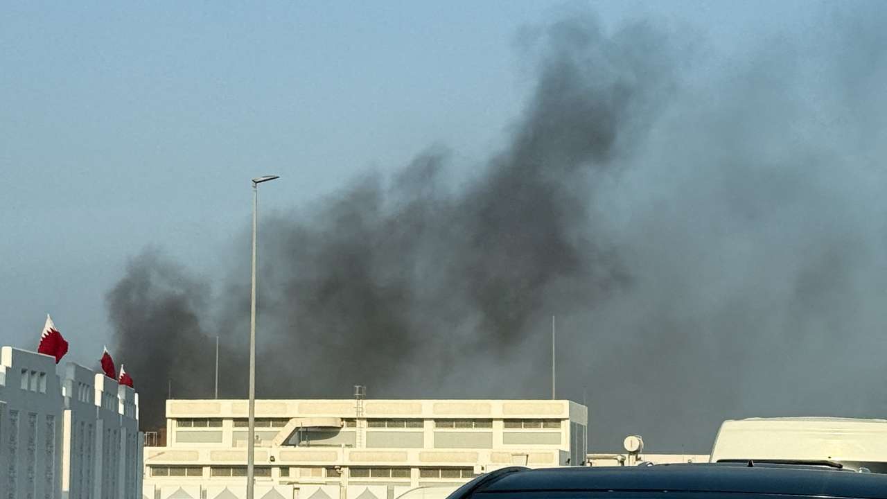 Smoke rises after several blasts were heard in Doha