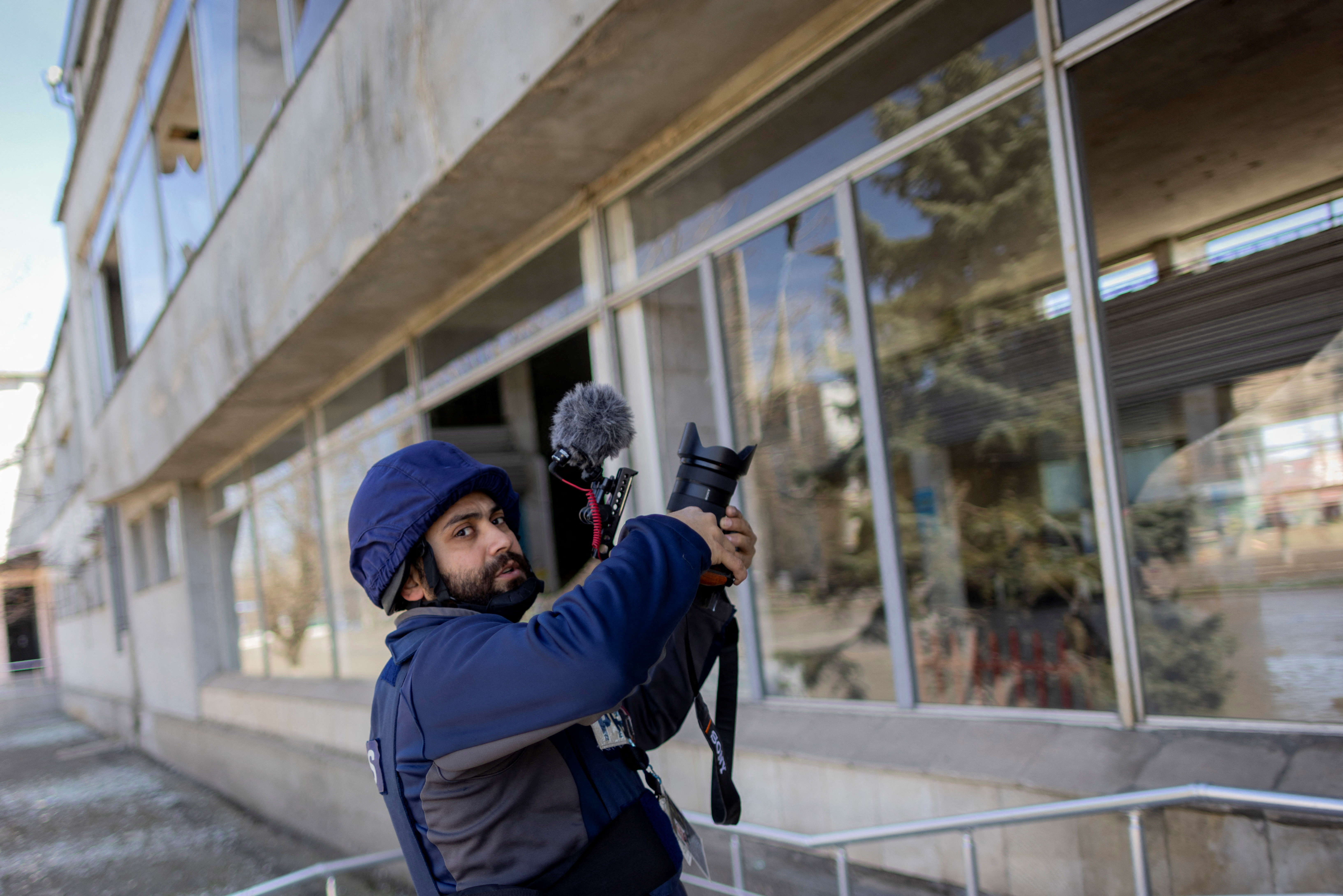 FILE PHOTO: Reuters' journalist Issam Abdallah films during an assignment at a damaged train station in Mykolaiv