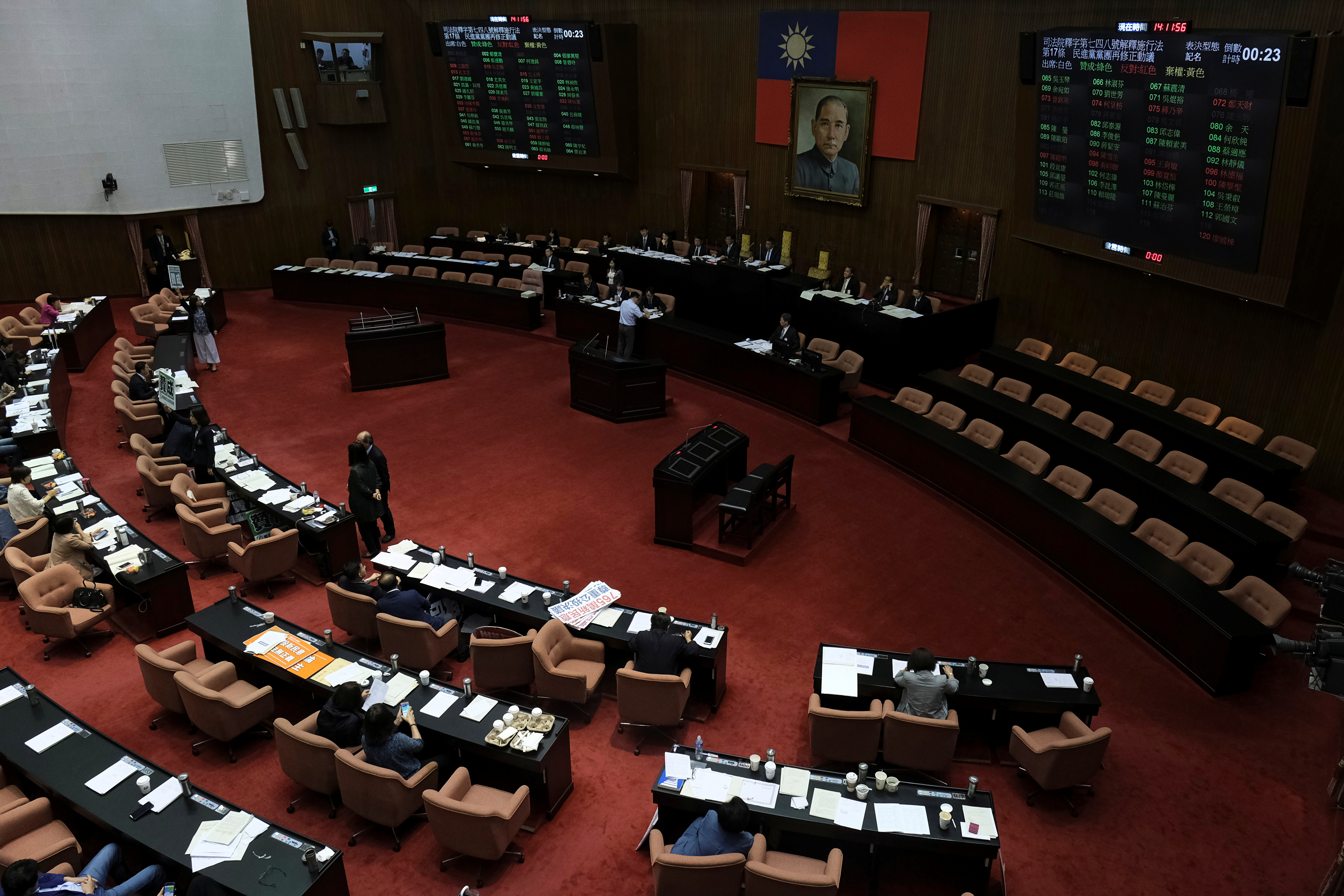 Legislators vote on three draft bills of a same-sex marriage law, inside the Legislative Yuan in Taipei